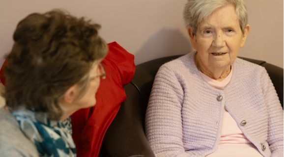 Caregiver gently assisting an individual